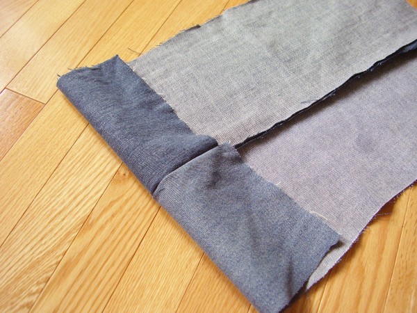 Stitch denim pieces together to make a pillow cover