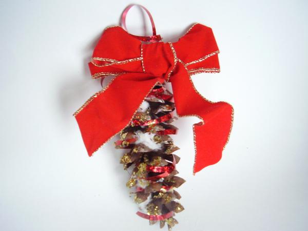 Decorate pine cones with glitter and bows