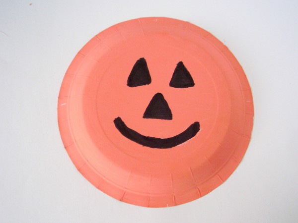 Paint a paper plate pumpkin with kids