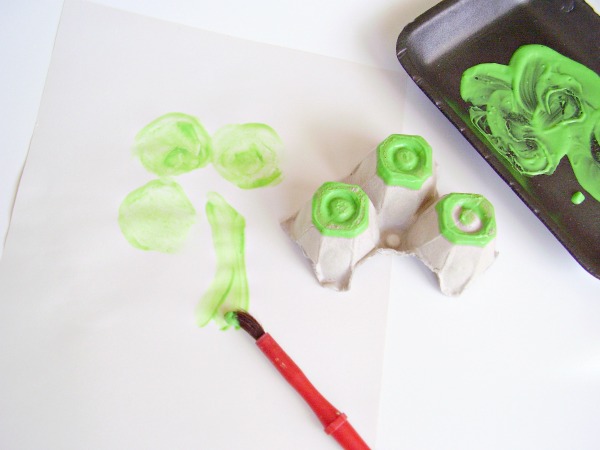 Paint a stem on shamrock painting with green paint