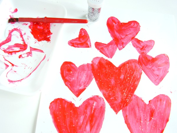 Paint with heart shaped stencils in different sizes