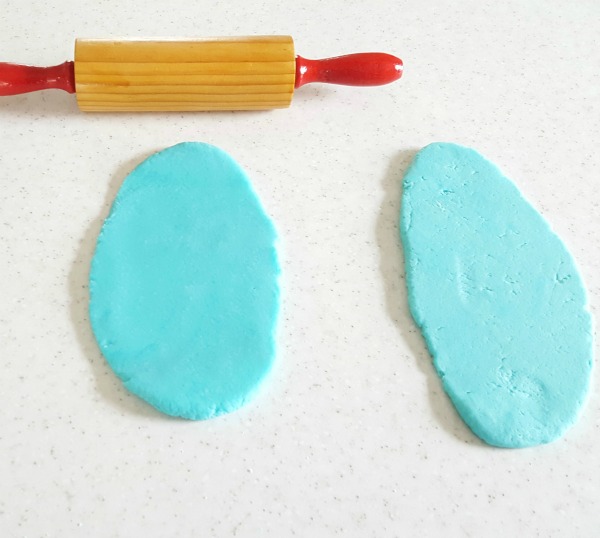Roll out homemade play dough with a kids rolling pin