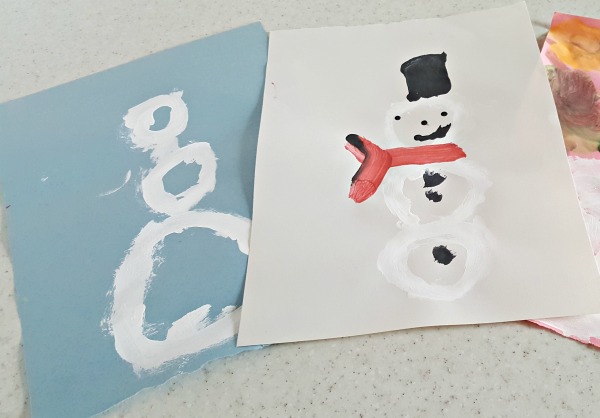 Painting picture of snowman with preschoolers