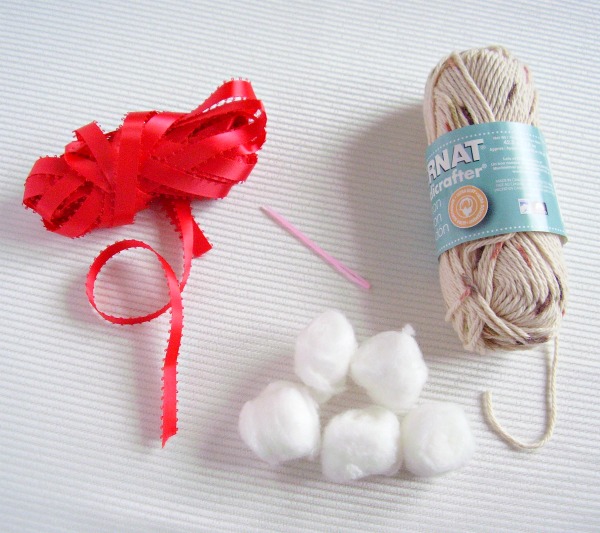 Supplies for a snowball ornament craft