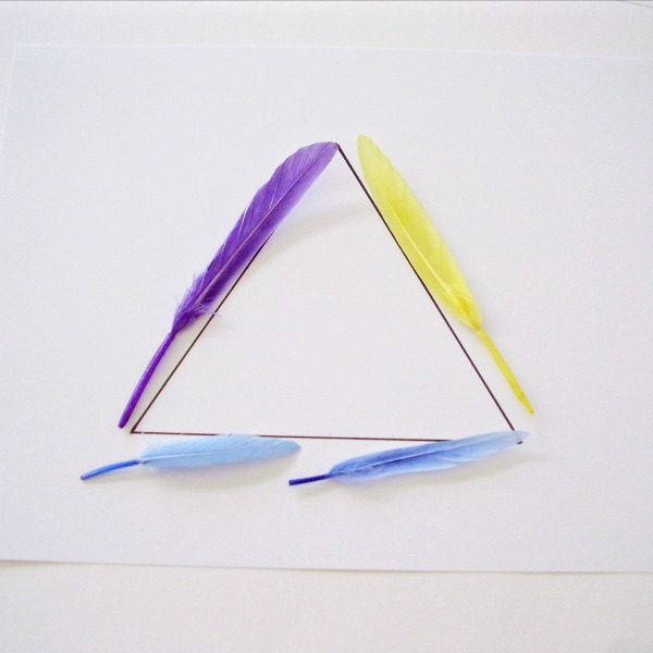 Triangle shape outlined with feathers in a math activity for kids