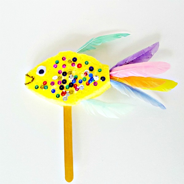 Fish puppet kids can make with a sponge and feathers