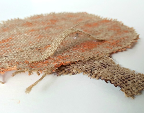 Glue a strip of burlap to the back of the jack o lantern craft for a hanger.