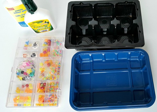 Supplies for a glue and beads science activity with preschoolers