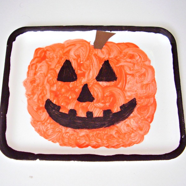 Kids can paint jack-o-lantern pictures on foam trays for Halloween decoration