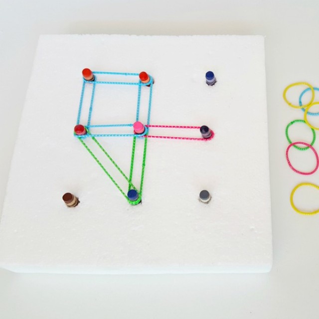 Make a geoboard with recycled crayons and elastics for preschool math activities