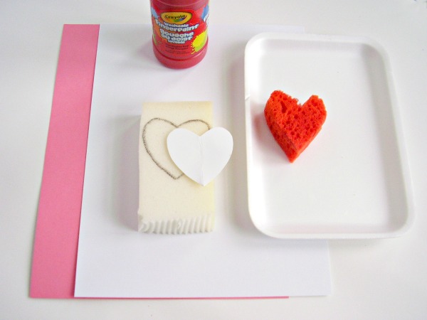 Supplies for a Valentine painting activity with kids