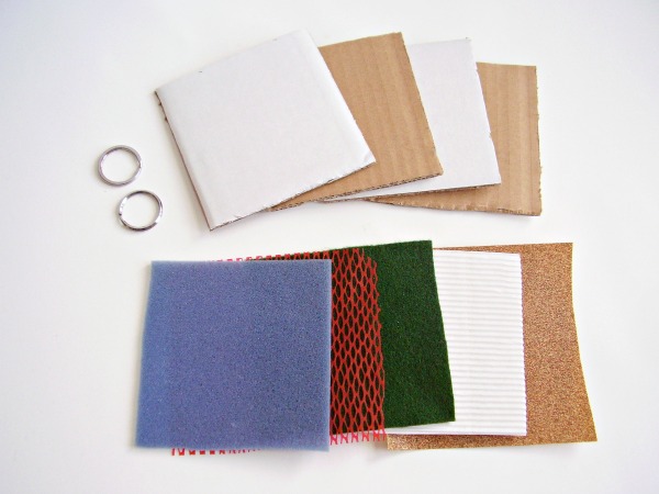 Supplies for a homemade sense of touch book for early learners