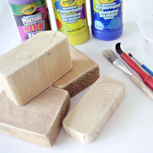 Supplies for a painting activity with wood blocks