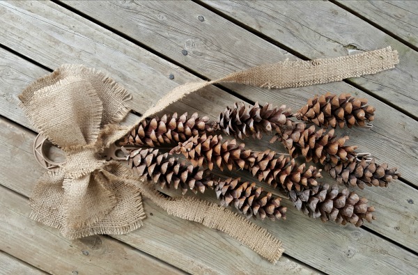 Pine cones and burlap bow for a Christmas craft