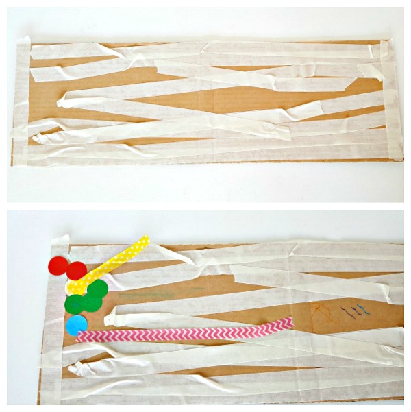 Masking tape and crayons artwork on a cardboard canvas