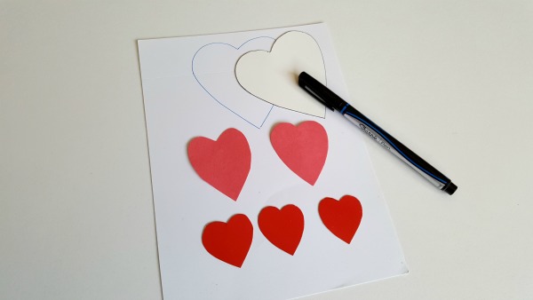 Heart cut outs to decorate containers for bean bag game