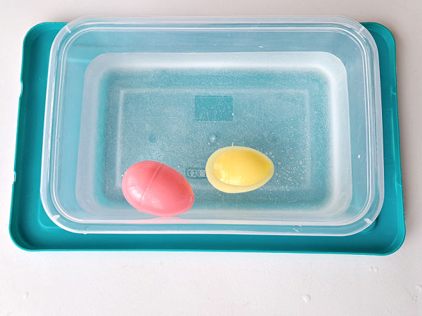 fun with plastic Easter eggs in water