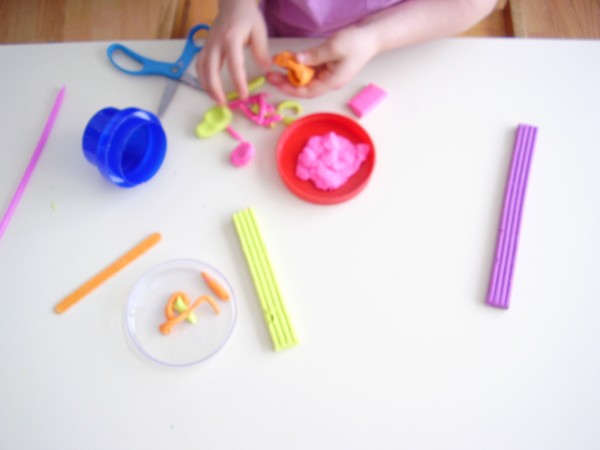 Cut and roll modeling clay for fine motor development 