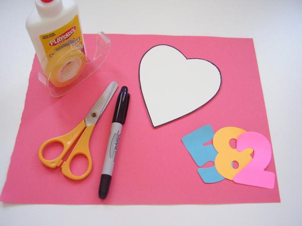 Paper heart cutouts kids Valentine game