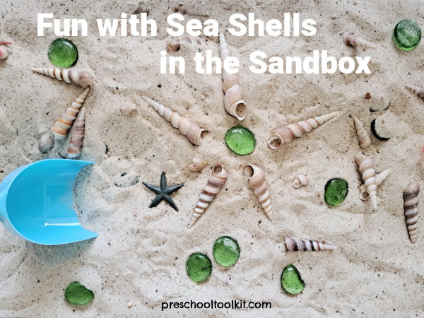 Preschool sandbox play with shells and pebbles
