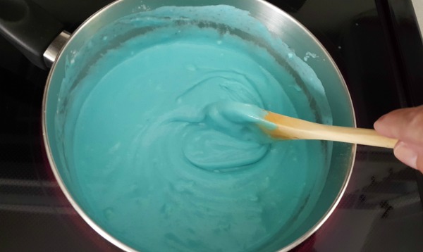 Mix ingredients for homemade play dough in a small saucepan