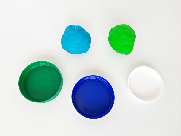 Play dough activity with jar lids