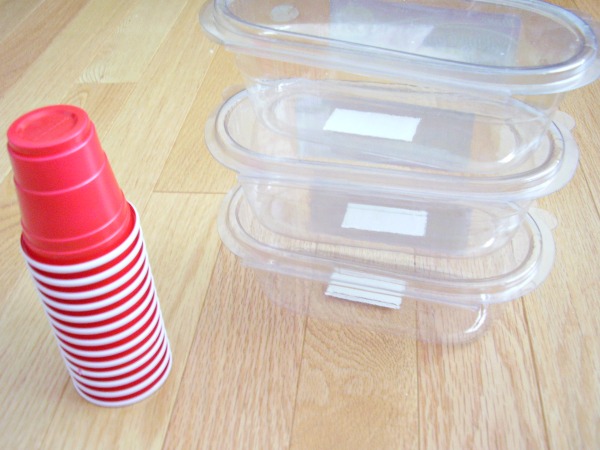 Recycle containers and paper cups for stacking activities with preschoolers