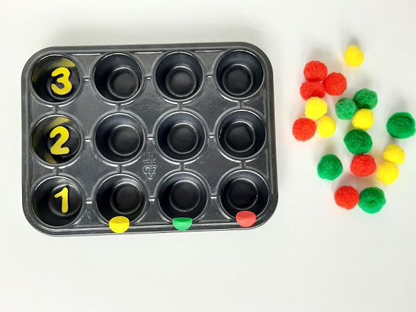 Toddler math activity graphing with pompoms