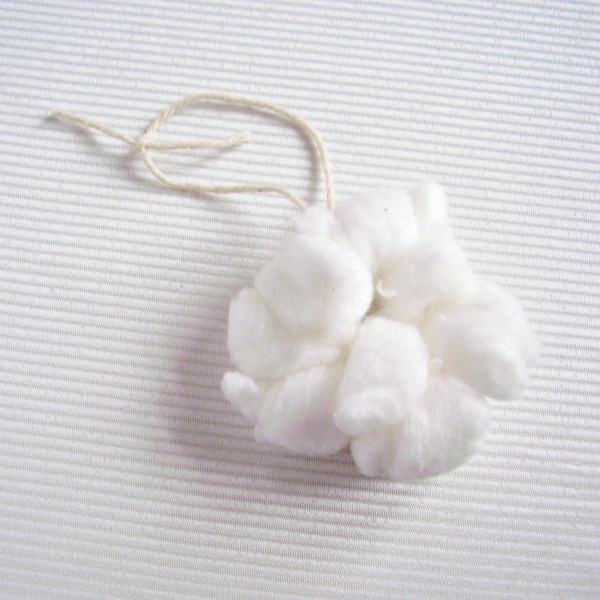 Tie the lacing yarn to form a hanger for the snowball ornament
