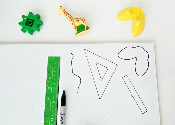 Trace objects onto paper for a matching activity