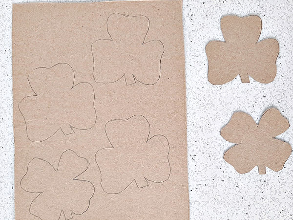 Cardboard shamrocks painting and math prek activity