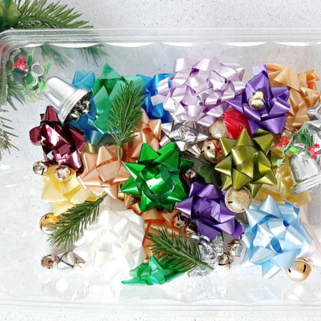 Christmas preschool sensory play with recycled bows and jingle bells