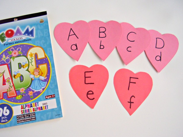 Foam letters and heart shapes cut from cardstock for a literacy activity