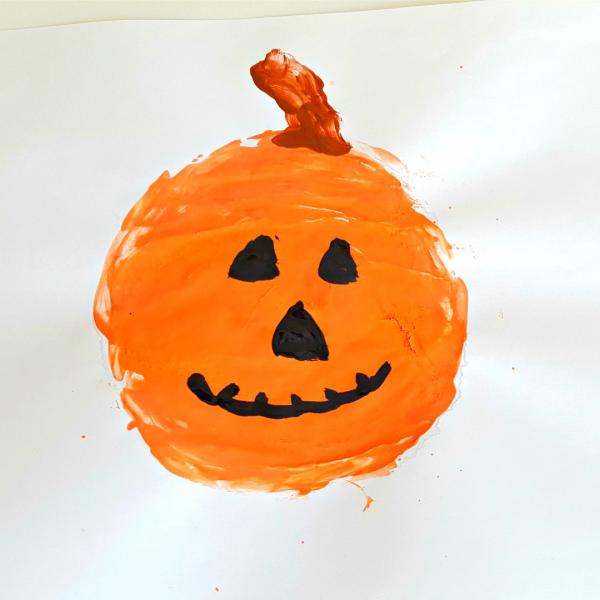 Halloween painting activity creating a jack o lantern