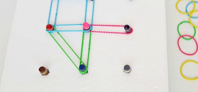 Make a geoboard with recycled crayons and elastics for preschool math activities