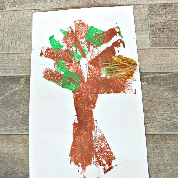 Painted tree with bird nest preschool craft for spring