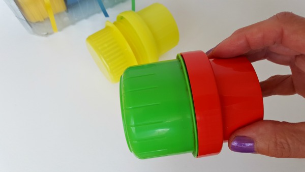 Put two laundry bottle caps together to make simple instruments for kids