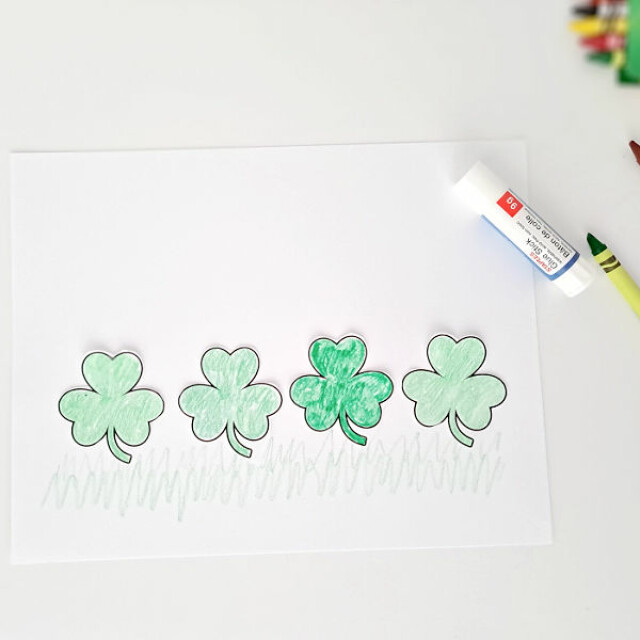 St. Patricks Day preschool craft with shamrock cutouts