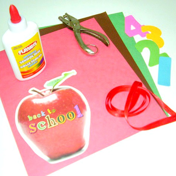 Supplies for an apple rhyming game