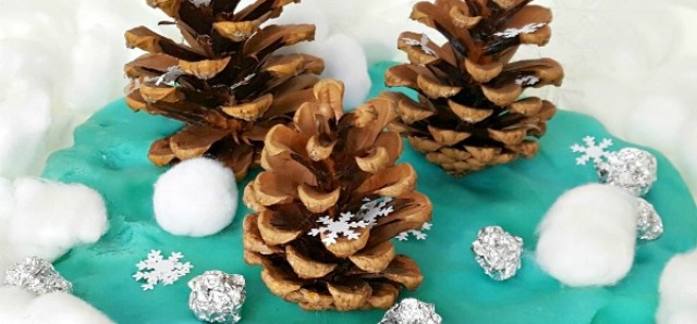 Winter sensory play with pine cones and play dough for toddlers and preschoolers