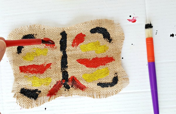 add paint to the design on the burlap butterfly