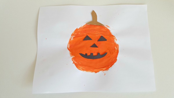 Add paper features to make a jack o lantern