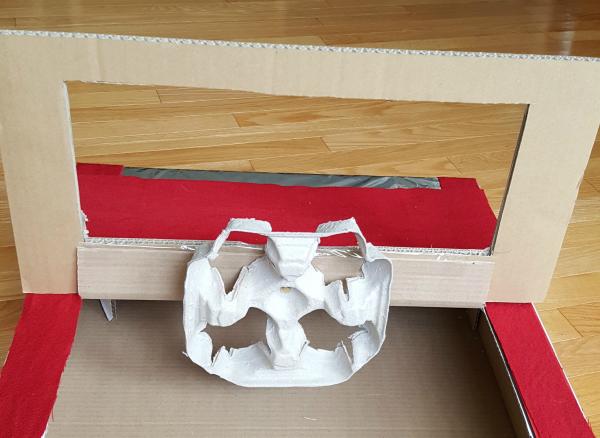 Add steering wheel to cardboard box car with paper fastener