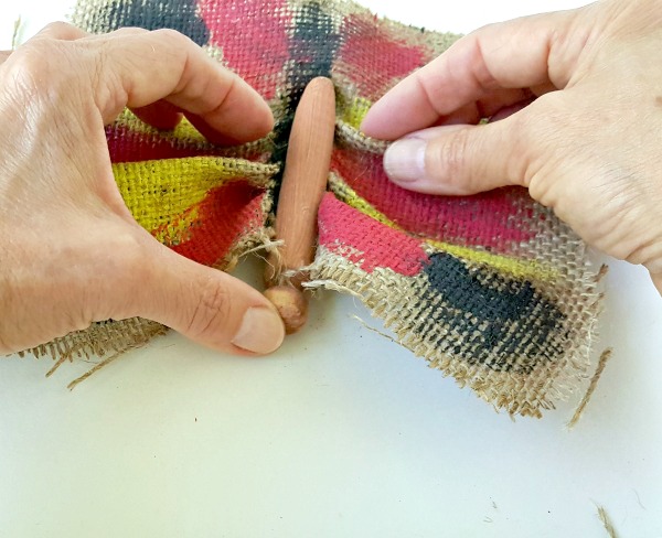 burlap fabric tucks securely into clothes peg