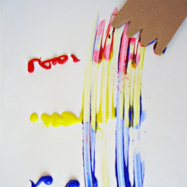 Cardboard paint spreader easy to make for preschool process art activities