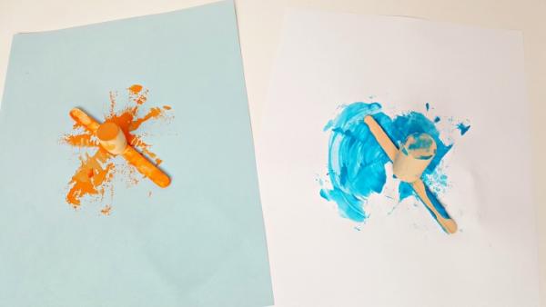 Orange and blue painting with craft sticks