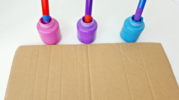 recycle cardboard to use as a canvas in a preschool painting activity