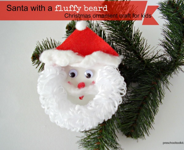Hand made Christmas ornament a red glazed Santa with a Cowboy hat and shiny star on its beard,