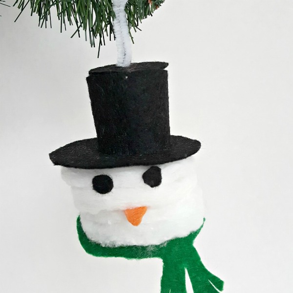 Snowman Christmas ornament kids can make with cotton rounds and felt