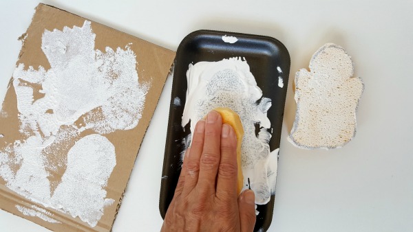 Press sponge on paper to make imprints of ghosts